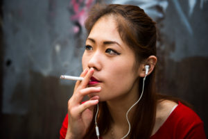 young Chinese with the smoking young Chinese with the smoking